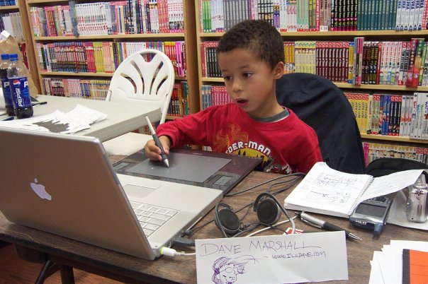 photo of six-year-old Sam Marshall drawing on my Wacom